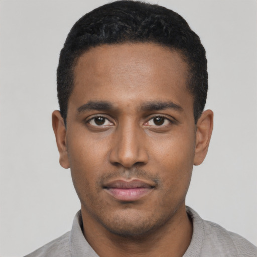 Neutral black young-adult male with short  black hair and brown eyes