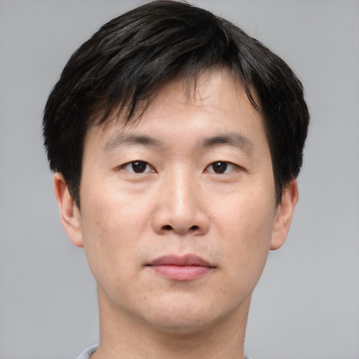 Neutral asian young-adult male with short  black hair and brown eyes