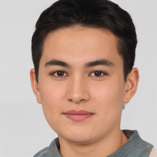 Joyful asian young-adult male with short  brown hair and brown eyes