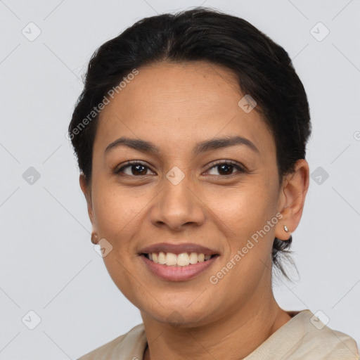 Joyful latino young-adult female with short  brown hair and brown eyes