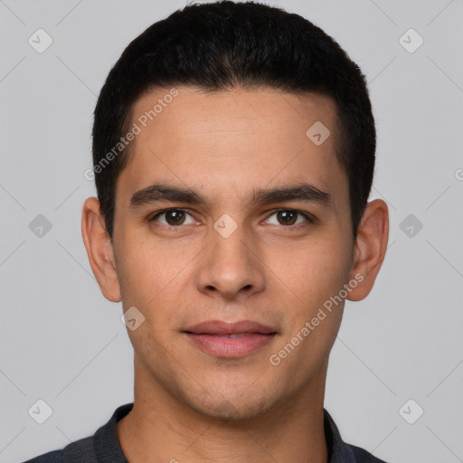 Joyful white young-adult male with short  black hair and brown eyes