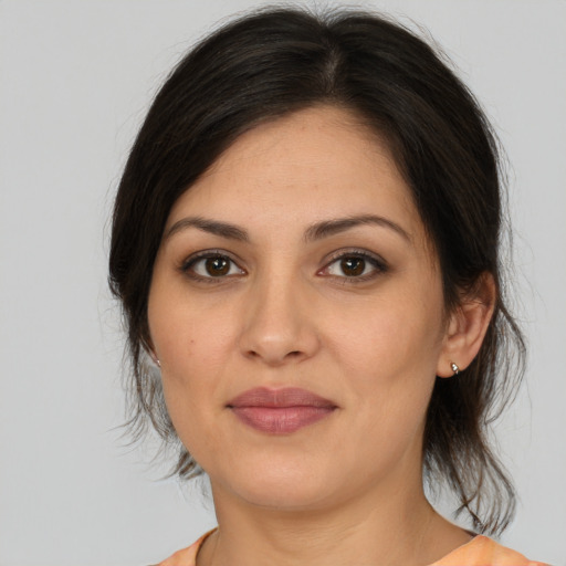 Joyful white young-adult female with medium  brown hair and brown eyes