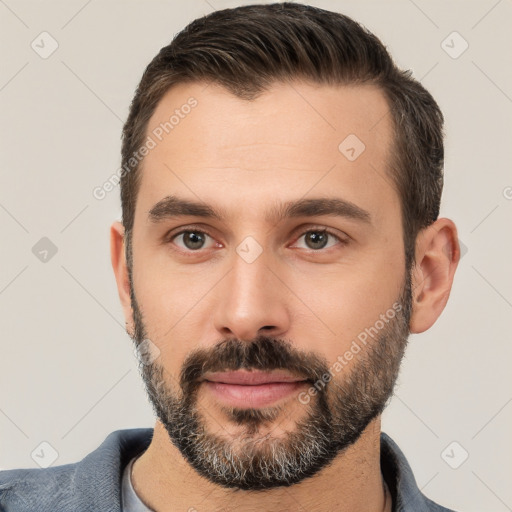 Neutral white young-adult male with short  brown hair and brown eyes