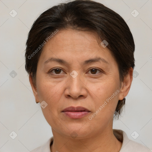 Joyful white adult female with short  brown hair and brown eyes