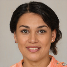 Joyful white young-adult female with medium  brown hair and brown eyes