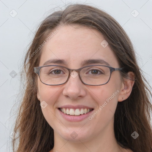 Joyful white young-adult female with long  brown hair and grey eyes