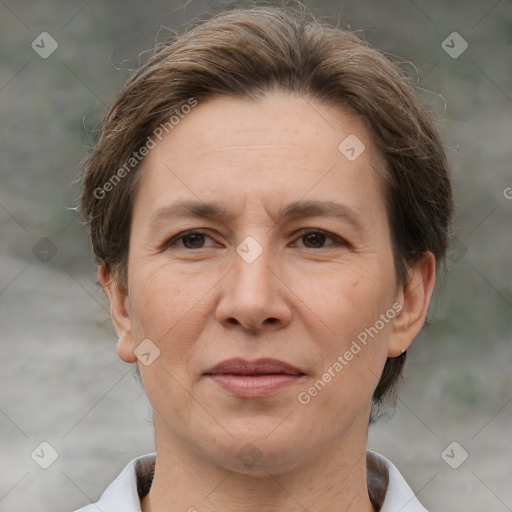 Joyful white adult female with short  brown hair and brown eyes