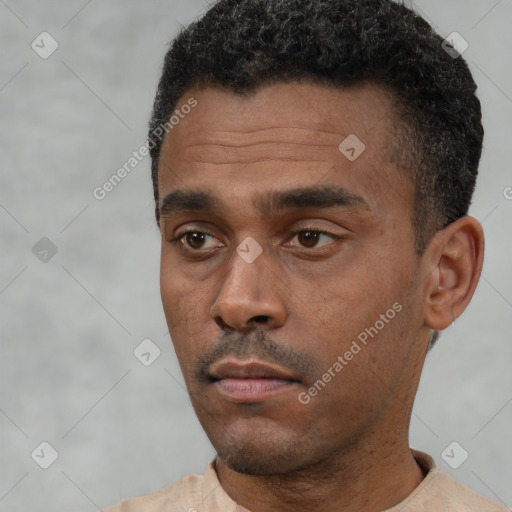 Neutral black young-adult male with short  black hair and brown eyes