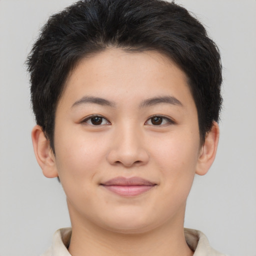 Joyful asian young-adult female with short  brown hair and brown eyes