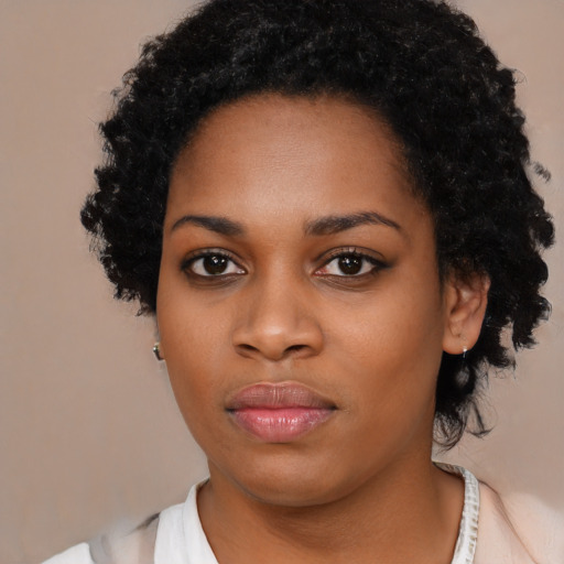Neutral black young-adult female with medium  black hair and brown eyes