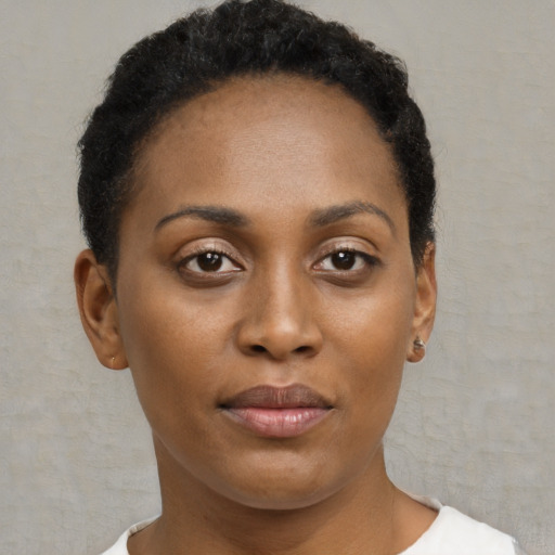 Neutral black young-adult female with short  brown hair and brown eyes