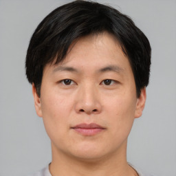 Neutral asian young-adult male with short  brown hair and brown eyes