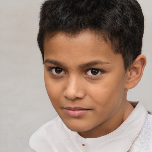 Joyful white child male with short  brown hair and brown eyes