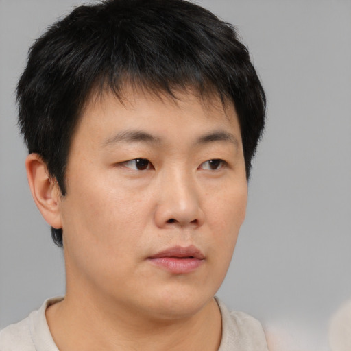 Neutral asian young-adult male with short  brown hair and brown eyes