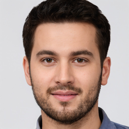 Joyful white young-adult male with short  brown hair and brown eyes