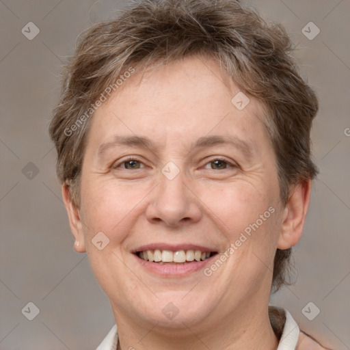 Joyful white adult female with short  brown hair and brown eyes