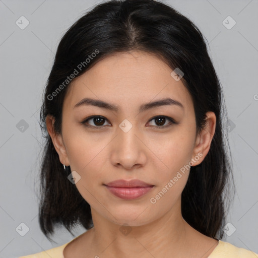 Joyful latino young-adult female with medium  brown hair and brown eyes