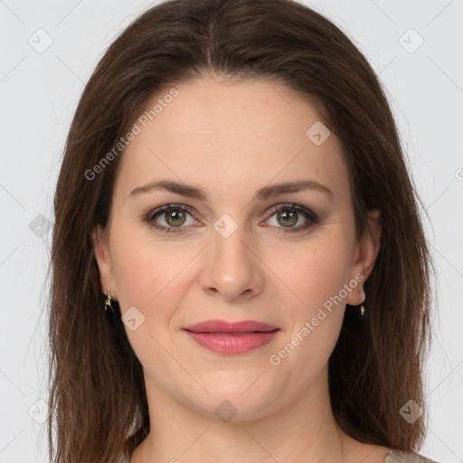 Joyful white young-adult female with long  brown hair and grey eyes