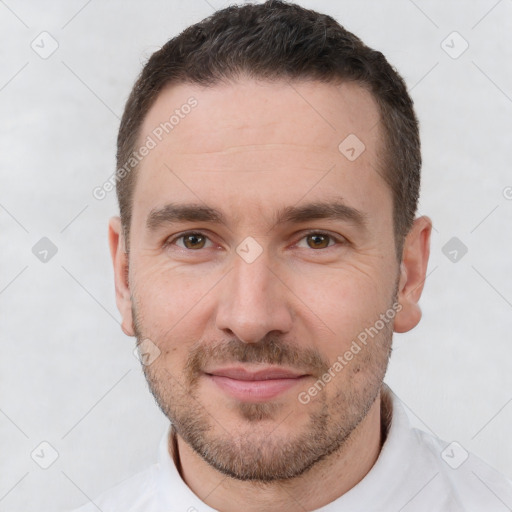 Joyful white adult male with short  brown hair and brown eyes