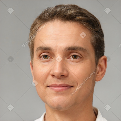 Joyful white adult male with short  brown hair and brown eyes