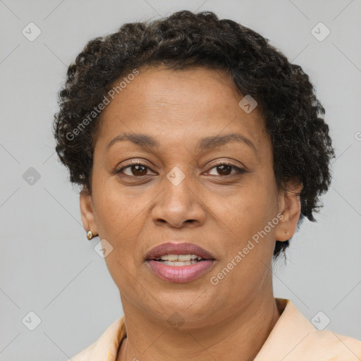 Joyful black adult female with short  brown hair and brown eyes