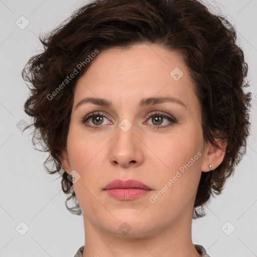 Joyful white young-adult female with medium  brown hair and green eyes