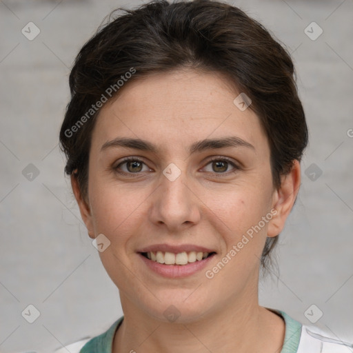 Joyful white young-adult female with short  brown hair and grey eyes