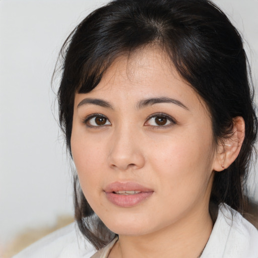 Joyful asian young-adult female with medium  brown hair and brown eyes