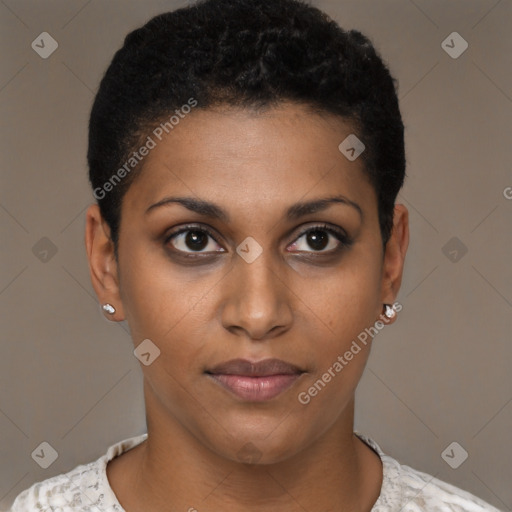 Joyful black young-adult female with short  brown hair and brown eyes