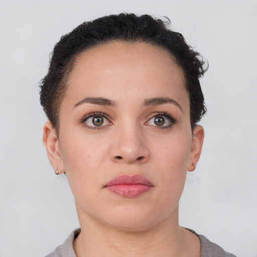 Neutral latino young-adult female with short  brown hair and brown eyes