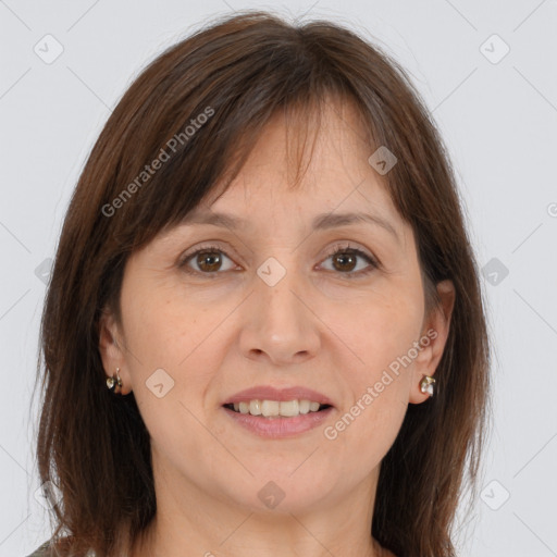 Joyful white adult female with medium  brown hair and brown eyes