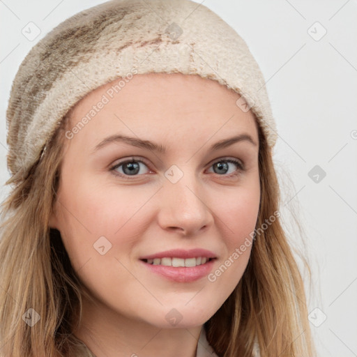 Joyful white young-adult female with long  brown hair and grey eyes