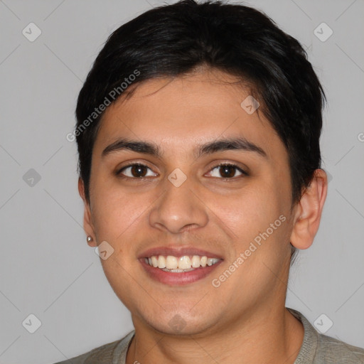 Joyful latino young-adult male with short  black hair and brown eyes