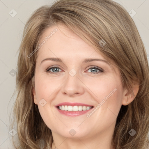 Joyful white young-adult female with long  brown hair and green eyes