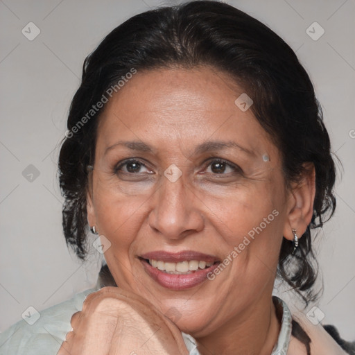 Joyful latino adult female with medium  brown hair and brown eyes