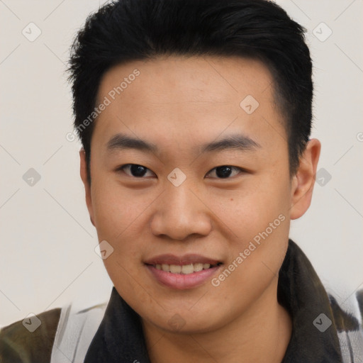 Joyful asian young-adult male with short  black hair and brown eyes