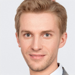 Joyful white adult male with short  brown hair and grey eyes