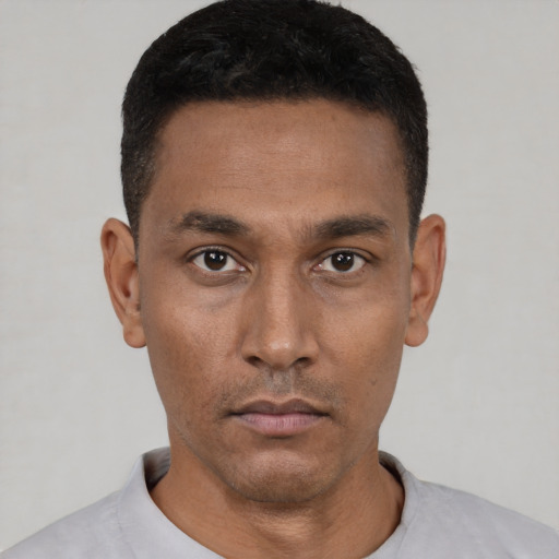 Neutral black young-adult male with short  black hair and brown eyes