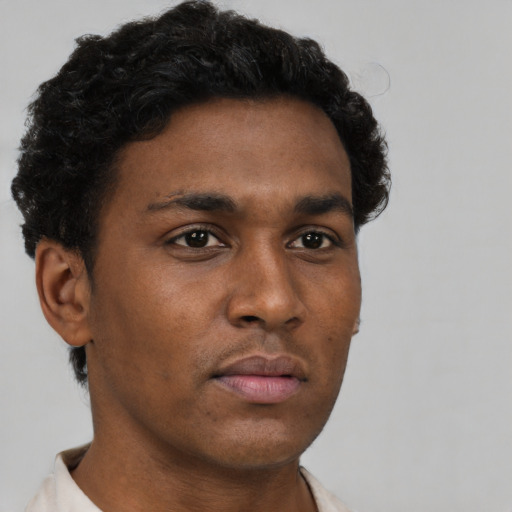 Neutral black young-adult male with short  brown hair and brown eyes