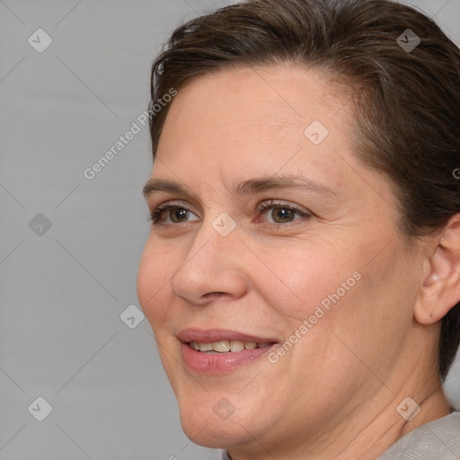 Joyful white adult female with short  brown hair and brown eyes