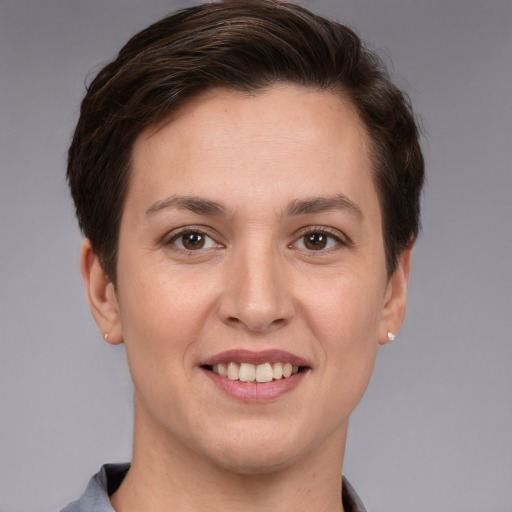 Joyful white young-adult female with short  brown hair and brown eyes