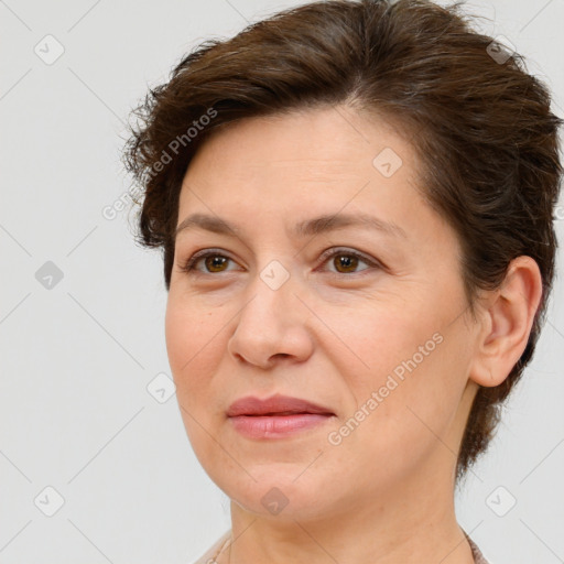 Joyful white adult female with short  brown hair and brown eyes