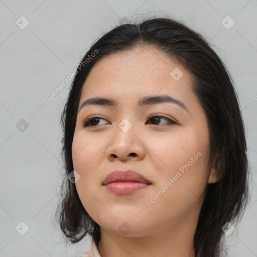 Joyful asian young-adult female with long  brown hair and brown eyes