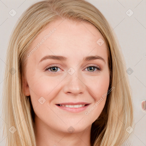 Joyful white young-adult female with long  brown hair and blue eyes