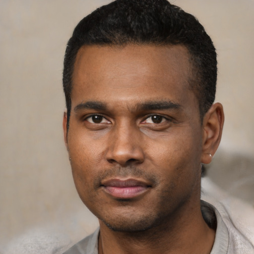 Neutral black young-adult male with short  black hair and brown eyes
