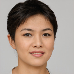 Joyful asian young-adult female with short  brown hair and brown eyes