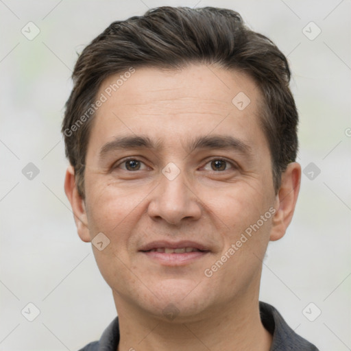 Joyful white adult male with short  brown hair and brown eyes