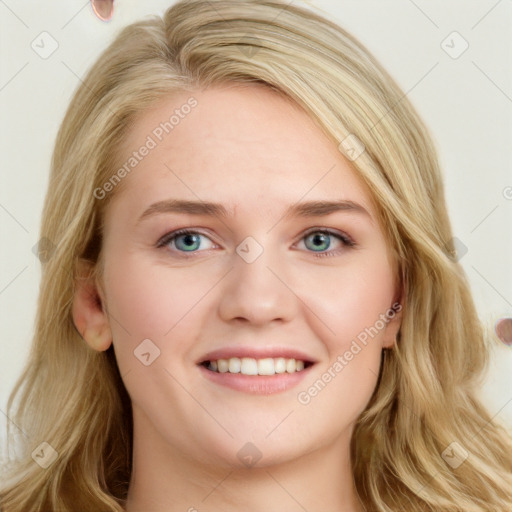 Joyful white young-adult female with long  brown hair and blue eyes