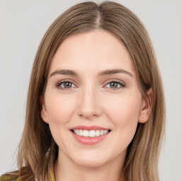 Joyful white young-adult female with medium  brown hair and green eyes