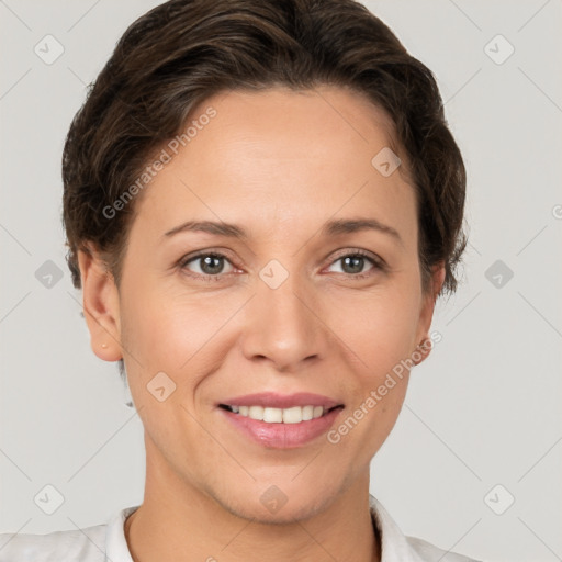 Joyful white adult female with short  brown hair and brown eyes